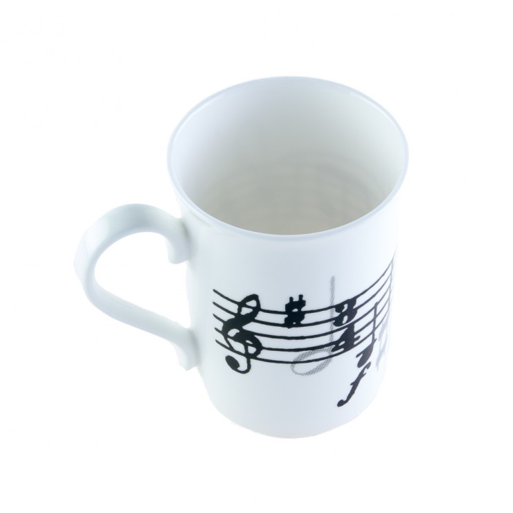 Tasse en porcelaine, partition et clé de sol
